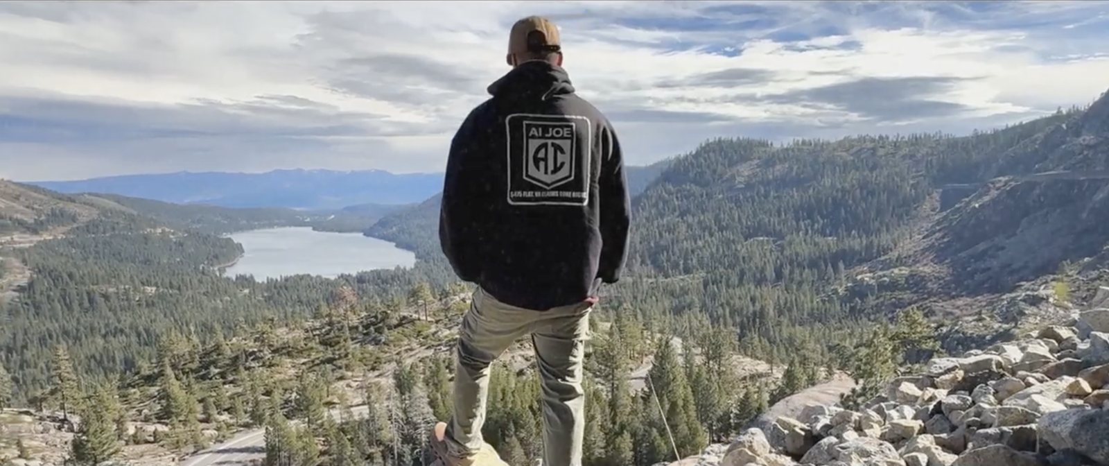 Erik Menezes in an AI Joe hoodie overlooking Donner Lake